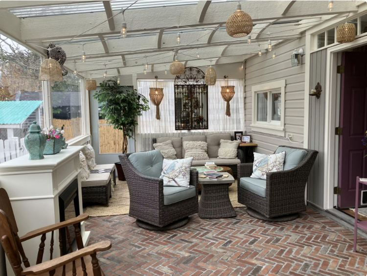 Cozy outdoor patio with furniture and decorative thin brick floor